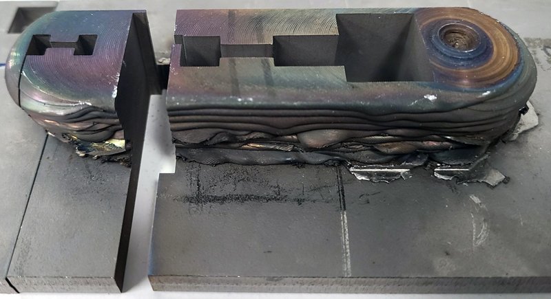 Solid-state 3D printing technology from MELD Manufacturing was used to build this workpiece. Several test samples have been removed in order to analyze its metallurgical properties.
